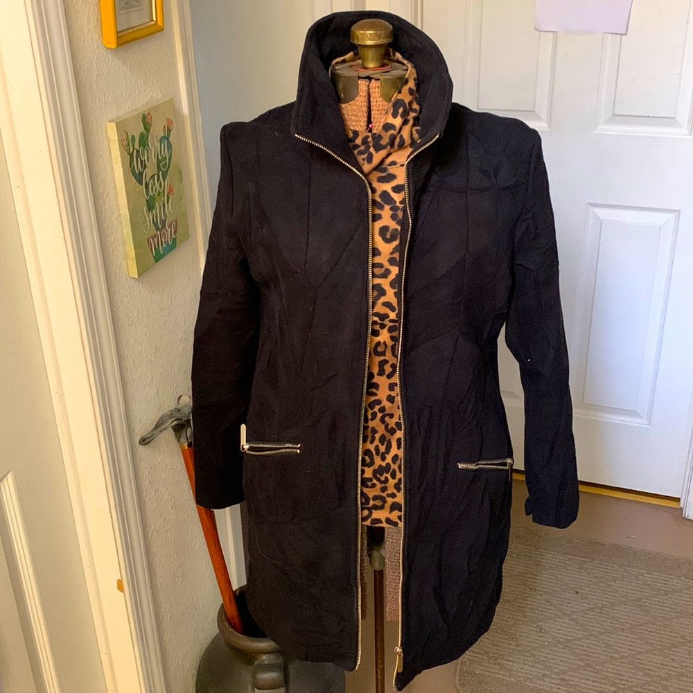 Stylish black jacket with gold accents.